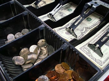 Drawer with coins and cash